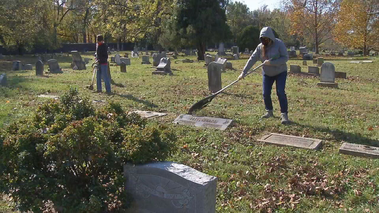 Volunteers gather on Day of the Dead to clean up Eastern Cemetery